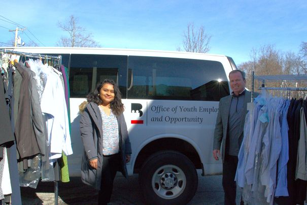 Jasmin Argueta Youth and Career Development Coordinator for The Office of Youth Employment and Opportunity and Norfolk County Register of Deeds William P. O’Donnell, prepare to load donations for the 2024 City of Boston Youth Jobs & Resource Fair at the Reggie Lewis Track and Athletic Complex.