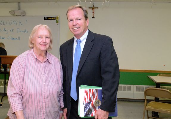 Register of Deeds William P. O'Donnell and Kathleen Hallett, Founder of Senior Connections, pose for a photo during a speaking event for Senior Connections at St. Mary’s Parish in Wrentham, as part of his ongoing efforts to bring the Registry of Deeds directly to the residents of Norfolk County.
